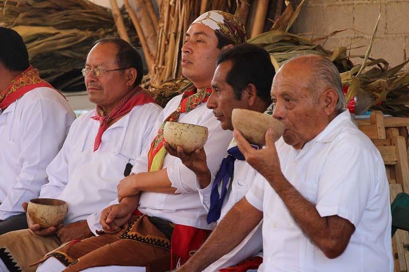 men drinking the cocoa beverage